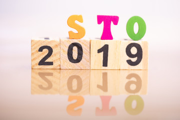 Wood block 2019 and Wood block word STO (Security Token Offering). Cryptocurrency blockchain business banner concept. virtual cryptocurrency concept.