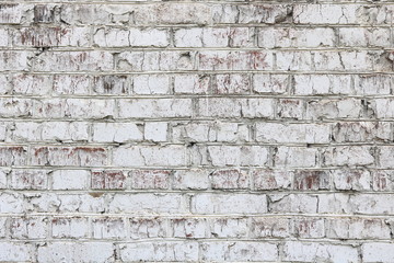 Old wall made of red brick, painted white in loft style for modern designer interior of room, bar or restaurant