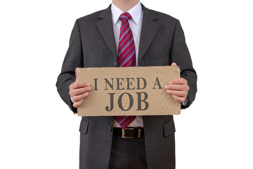 Businessman holding card with the words I NEED A JOB