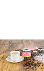 Coffee and donuts on wooden table with white backgroung.