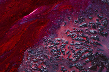 Abstract art texture background. Flowing lava design. Beautiful red and purple paints with shimmering effect.