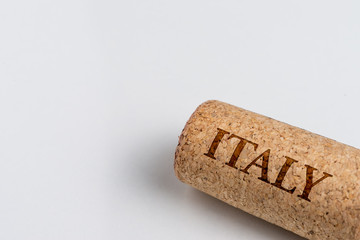 Wine cork isolated on the white. Recording the name of the Country Italy.