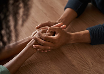 Close-up of couple holding each other's hand