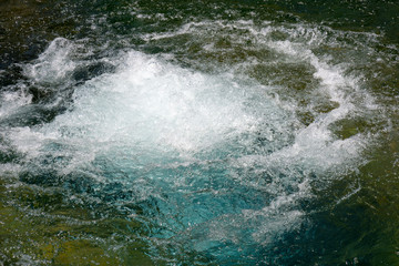 Geyser and hot spring in old faithful basin in Yellowstone National Park in Wyoming
