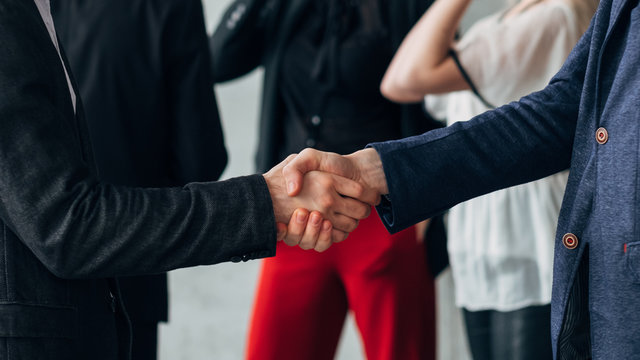 Corporate meetup. Modern business forum. Handshake greeting. Successful people introduce themselves at seminar.