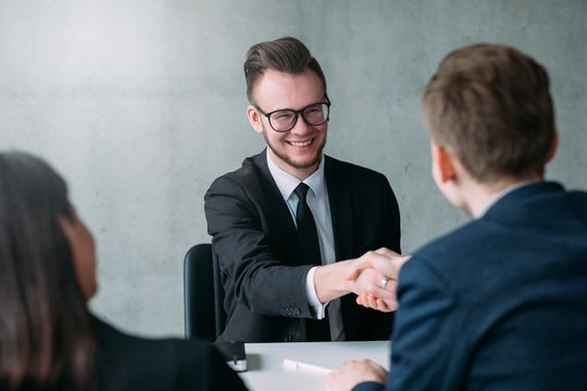 Successful job interview. Professional career. Human resources. Young male applicant got hired for the position.