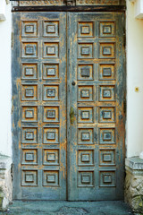 vintage wooden door and old white wall as background