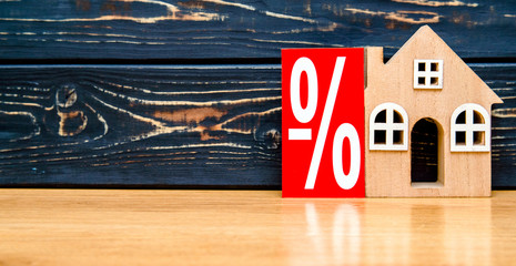 House symbol on a brown wooden background 