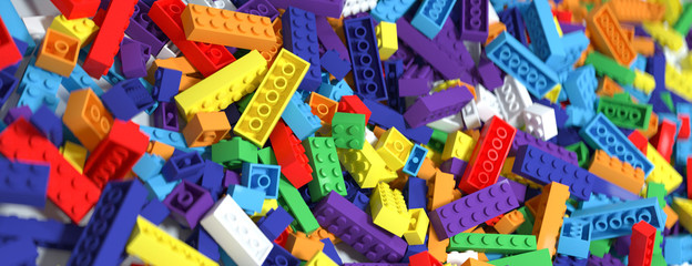 Fototapeta na wymiar Colored toy bricks background. Rainbow colors. 3D Rendering