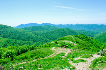landscape with green hills and blue sky