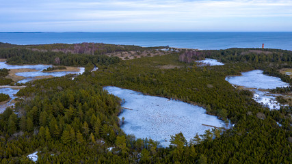 Icy lake in nature, sea in the background