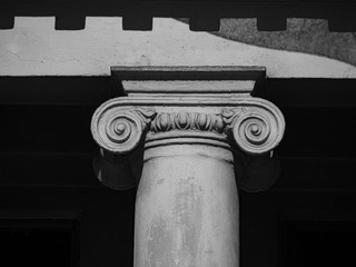 Black and white photo of an antique column. Close up.