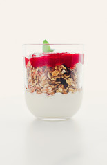 Homemade granola parfait with strawberry jam and mint, yogurt and muesli for healthy breakfast in...
