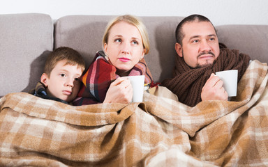 Ill family wrapping in blanket