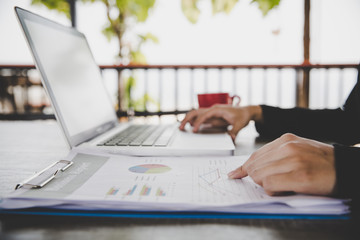 Business analysis concept. Businesswoman analyzing business documents, finacial report, working on...