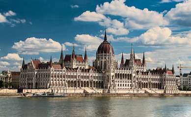 Obraz premium Building of the hungarian parliament in a Budapest, capital of Hungary, by the Danube river. One of the landmark of Budapest, and popular tourist destination.
