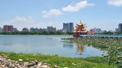 Spring and Autumn Pavilions on the Lotus Pond in Kaohsiung city in Taiwan. Bridge connects it to the shore. Panoramic view to the beautiful and popular tourist sightseeing attraction.