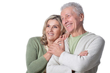 Happy senior couple posing isolated on white background