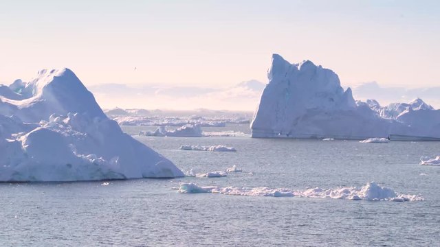 iceberg floats in water in Arctic Ocean  Greenland