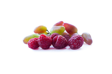 Ripe raspberries and grapes. Background of mix berries with copy space for text. Mix berries on white background. Berries isolated on white background.