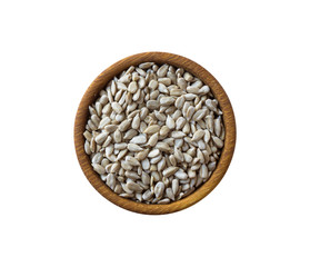 Sunflower seeds isolated on white background. Top view. Sunflower seeds in a wooden bowl isolated on white background.Sunflower seeds with copy space for text.