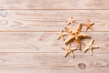 Starfish, seashells on a wooden table, top view, flat lay with copy space
