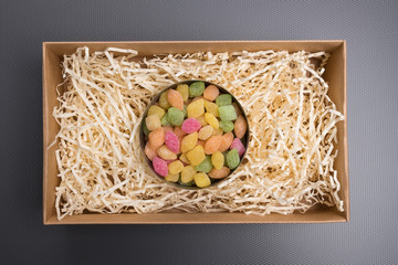 Candy in a jar. Candy in a carton box. Gift box with candy. Tin can with colored lollipops on a...