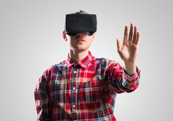 Guy in mask experiencing virtual reality as new entertainment device