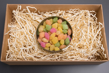 Candy in a jar. Candy in a carton box. Gift box with candy. Tin can with colored lollipops on a...