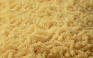 Boiled pasta forming a background
