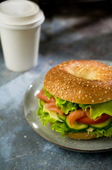 Breakfast bagel with salmon and lettuce