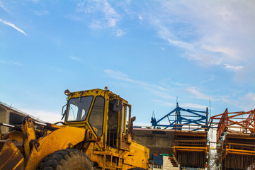 Obraz premium yellow excavator on construction site