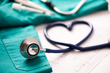 Medical stethoscope twisted in heart shape. - obrazy, fototapety, plakaty
