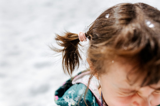 Portrait of a little girl in the snow
