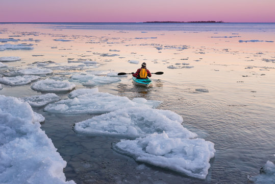 Man contemplates winter Ontario nature on kayak journey