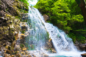 Fototapeta na wymiar Amazing waterfall in Bucegi Mountaiuns, Urlatoarea waterfall