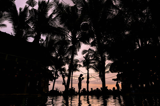 Unrecognizable people having fun on a paradisiacal beach.