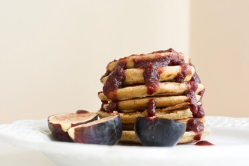Tasty pancakes with cherry jam.