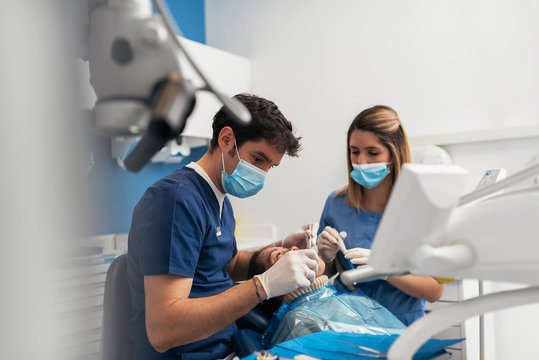 Dentist during a dental intervention.