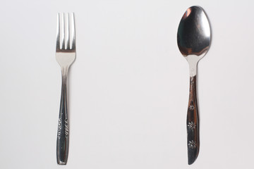 Cutlery , spoon and fork on white background