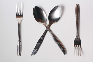 Cutlery , spoon and fork on white background