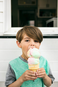 Treat: Boy Takes Big Bite Of Ice Cream Cone