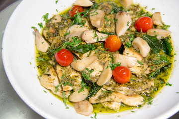  cooked fish with butter sauce in dish