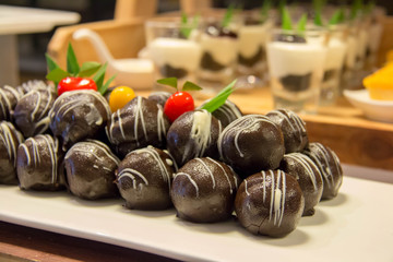  dark chocolate ball on plate in buffet