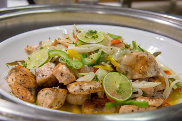  cooked fish with butter sauce in dish