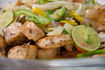  cooked fish with butter sauce in dish