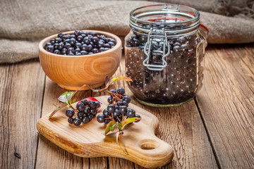 Fototapeta na wymiar Fruits of black chokeberry prepared for processing.