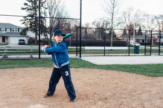 Young boy getting readdy to bat a baseball