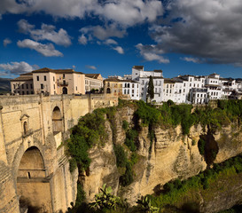 Obraz premium Clouds over El Tajo Gorge on the Guadalevin river with new bridge at Ronda Spain