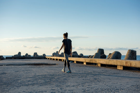 Female athlete walking at the piers near Varna